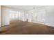 Bright living room featuring new carpet, neutral paint, abundant natural light, and an open layout at 2008 Royal Gardens Pl, North Las Vegas, NV 89084
