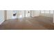 Spacious carpeted living room with tile flooring beyond, offering ample natural light and open floor plan at 2008 Royal Gardens Pl, North Las Vegas, NV 89084