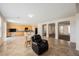 Open-concept living room with tile flooring, a large kitchen, and spacious entryway at 2008 Royal Gardens Pl, North Las Vegas, NV 89084