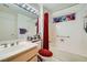 Cozy bathroom showcasing a vanity with a soaking tub-shower combination at 2401 Ocean Edge Ct, Las Vegas, NV 89134