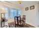 Cozy breakfast nook with bay window and charming decor, perfect for morning meals at 2401 Ocean Edge Ct, Las Vegas, NV 89134