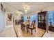 Bright dining room with elegant chandelier, mirrored wall, and decorative hutch at 2401 Ocean Edge Ct, Las Vegas, NV 89134