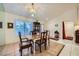 Well-lit dining room with a stylish light fixture and a classic dining set at 2401 Ocean Edge Ct, Las Vegas, NV 89134
