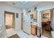 Bright kitchen with white cabinets, and a view into the living area at 2401 Ocean Edge Ct, Las Vegas, NV 89134