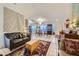 Spacious living room featuring tile flooring, dining area and stylish decor at 2401 Ocean Edge Ct, Las Vegas, NV 89134