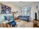 Inviting living room features a bay window, cozy seating, and ample natural light at 2401 Ocean Edge Ct, Las Vegas, NV 89134