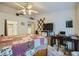 Spacious main bedroom featuring a large bed, a workstation, and a ceiling fan at 2401 Ocean Edge Ct, Las Vegas, NV 89134
