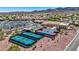 Aerial view of the community showcasing its tennis courts and lush surroundings, ideal for outdoor enthusiasts at 2616 Red Planet St, Henderson, NV 89044