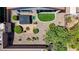 Aerial view showcasing a well-maintained backyard with a hot tub, patio, and desert landscaping at 2616 Red Planet St, Henderson, NV 89044