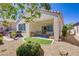 Inviting backyard features a covered patio, synthetic lawn, and a relaxing hot tub area at 2616 Red Planet St, Henderson, NV 89044