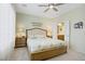 Comfortable bedroom featuring a ceiling fan, neutral paint, and a doorway to the en-suite bathroom at 2616 Red Planet St, Henderson, NV 89044