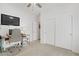 Bright bedroom boasts natural light, neutral decor, and an efficient built-in work space at 2616 Red Planet St, Henderson, NV 89044
