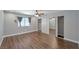 Spacious bedroom with a ceiling fan, laminate flooring, a window with blinds, and a mirrored sliding-door closet at 2708 Beaver Creek Ct # 202, Las Vegas, NV 89117