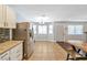 Bright dining area with stainless steel refrigerator and wood table at 2708 Beaver Creek Ct # 202, Las Vegas, NV 89117