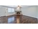 Spacious living room with hardwood floors and a stone fireplace at 2708 Beaver Creek Ct # 202, Las Vegas, NV 89117