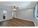 Large bedroom with hard surface floors, ceiling fan, a bathroom entry and window with light-filtering blinds at 2708 Beaver Creek Ct # 202, Las Vegas, NV 89117