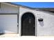 Charming home exterior featuring a gated entrance and attached garage at 3030 Liberty Cir, Las Vegas, NV 89121
