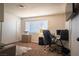 Home office space, complete with desk, rolling chair, and natural light at 3030 Liberty Cir, Las Vegas, NV 89121