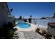 A backyard featuring a freeform pool, patio, and lush landscaping, ideal for outdoor enjoyment at 3030 Liberty Cir, Las Vegas, NV 89121