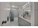 Bright bathroom with marble countertops, double sinks, and glass-enclosed shower with luxurious finishes at 3421 Rochelle Ct, Las Vegas, NV 89121