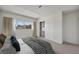 Serene bedroom featuring neutral tones, a walk-in closet, and a bright window with outdoor views at 3421 Rochelle Ct, Las Vegas, NV 89121