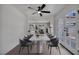 Elegant dining room with marble table, stylish chairs, and french doors for natural light at 3421 Rochelle Ct, Las Vegas, NV 89121