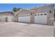 Two car garage with decorative accents, ample parking space and secure entry for peace of mind at 3421 Rochelle Ct, Las Vegas, NV 89121