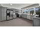 Spacious kitchen featuring gray cabinets, stainless steel appliances, and a large window with natural light at 3421 Rochelle Ct, Las Vegas, NV 89121