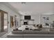 Bright living room with fireplace, neutral tones, and sliding glass doors leading to the outdoor area at 3421 Rochelle Ct, Las Vegas, NV 89121