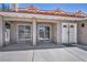 An outdoor patio area featuring sliding glass doors and a decorative front door for easy access at 3421 Rochelle Ct, Las Vegas, NV 89121
