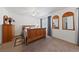 Bright bedroom with light wood furniture, ceiling fan, and decorative mirrors at 3561 Yorba Linda Dr, Las Vegas, NV 89122