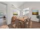 Bright dining room with vaulted ceilings, stylish light fixture, and seating for six at 3561 Yorba Linda Dr, Las Vegas, NV 89122