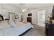 Inviting primary bedroom featuring carpet floors, a ceiling fan and an ensuite bathroom at 3561 Yorba Linda Dr, Las Vegas, NV 89122