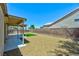 Backyard featuring covered patio, rock landscaping, and privacy wall at 3622 Covewick Dr, North Las Vegas, NV 89032