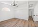 Bedroom boasts wood-look floors, modern lighting, and a large closet with sliding doors at 3622 Covewick Dr, North Las Vegas, NV 89032