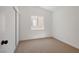 Bedroom features neutral carpet, window, and closet at 3622 Covewick Dr, North Las Vegas, NV 89032