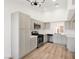 Bright kitchen features modern appliances, light gray cabinets, and white countertops at 3622 Covewick Dr, North Las Vegas, NV 89032