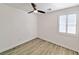 Bright bedroom with wood-look flooring, fan and natural light at 3829 N Mayfield Ranch Rd, Pahrump, NV 89060