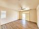 Bedroom with ample natural light, ceiling fan, and wood-look flooring at 3829 N Mayfield Ranch Rd, Pahrump, NV 89060