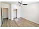 A well-lit bedroom with wood-look flooring and a ceiling fan at 3829 N Mayfield Ranch Rd, Pahrump, NV 89060