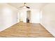Open bedroom with a ceiling fan and an archway to the primary bath at 3829 N Mayfield Ranch Rd, Pahrump, NV 89060