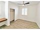 A bright bedroom with a ceiling fan and shuttered window at 3829 N Mayfield Ranch Rd, Pahrump, NV 89060
