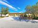 Charming single-story home featuring a three-car garage, desert landscaping, and a tile roof at 3829 N Mayfield Ranch Rd, Pahrump, NV 89060
