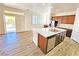 Modern kitchen featuring a marble island, stainless steel appliances, and wooden cabinetry at 3829 N Mayfield Ranch Rd, Pahrump, NV 89060