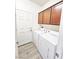 Functional laundry room with modern appliances and ample storage cabinets at 3829 N Mayfield Ranch Rd, Pahrump, NV 89060