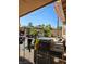 Outdoor barbecue area with seating, a grill, and mature trees, perfect for outdoor entertaining and summer cookouts at 4016 Mountain Trek St, Las Vegas, NV 89129