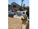 View of the backyard, partially cluttered, with storage items and potential for customization at 4016 Mountain Trek St, Las Vegas, NV 89129