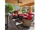 Cozy covered patio with comfortable seating, offering a relaxing space to enjoy the outdoors and the beautiful backyard at 4016 Mountain Trek St, Las Vegas, NV 89129