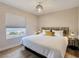 Relaxing bedroom with natural light, wood-style floors, and calming decor at 4072 E Harmon Ave, Las Vegas, NV 89121