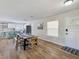 Open-concept dining area featuring modern finishes and wood flooring, seamlessly connecting to the kitchen at 4072 E Harmon Ave, Las Vegas, NV 89121